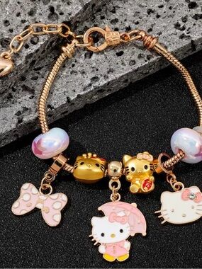 Hello Kitty Gold-Tone Pink Charm Bracelet for Kids.
